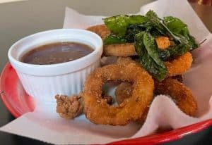 Crispy golden calamari rings appetizer at Tasty Thai Tempe, served hot with sweet chili sauce—favorite starter near ASU.