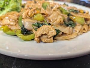 Drunken noodles from Tasty Thai Tempe with wide rice noodles, basil, and bell peppers in a spicy Thai sauce near downtown Tempe.