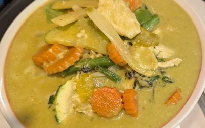 Green curry from Tasty Thai Tempe with coconut milk, basil, bamboo shoots, bell peppers, green beans, and zucchini near Broadway Road in Tempe.