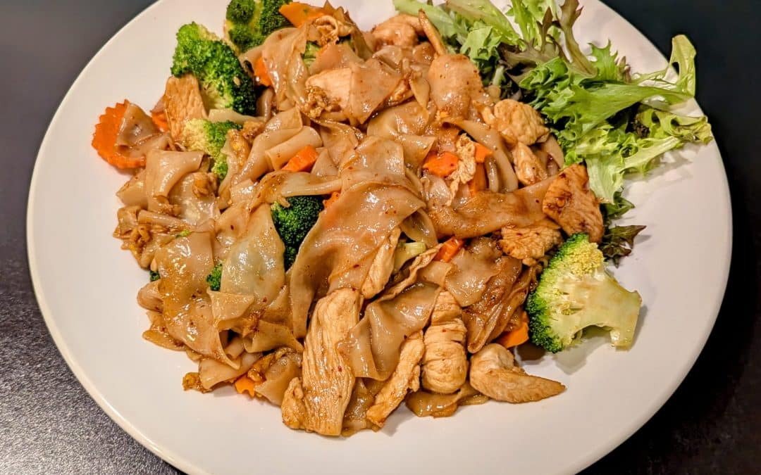 Pad See Ew from Tasty Thai Tempe with wide rice noodles, broccoli, and carrots in a sweet soy sauce near Mill Avenue.