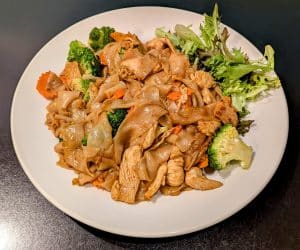 Pad See Ew from Tasty Thai Tempe with wide rice noodles, broccoli, and carrots in a sweet soy sauce near Mill Avenue.