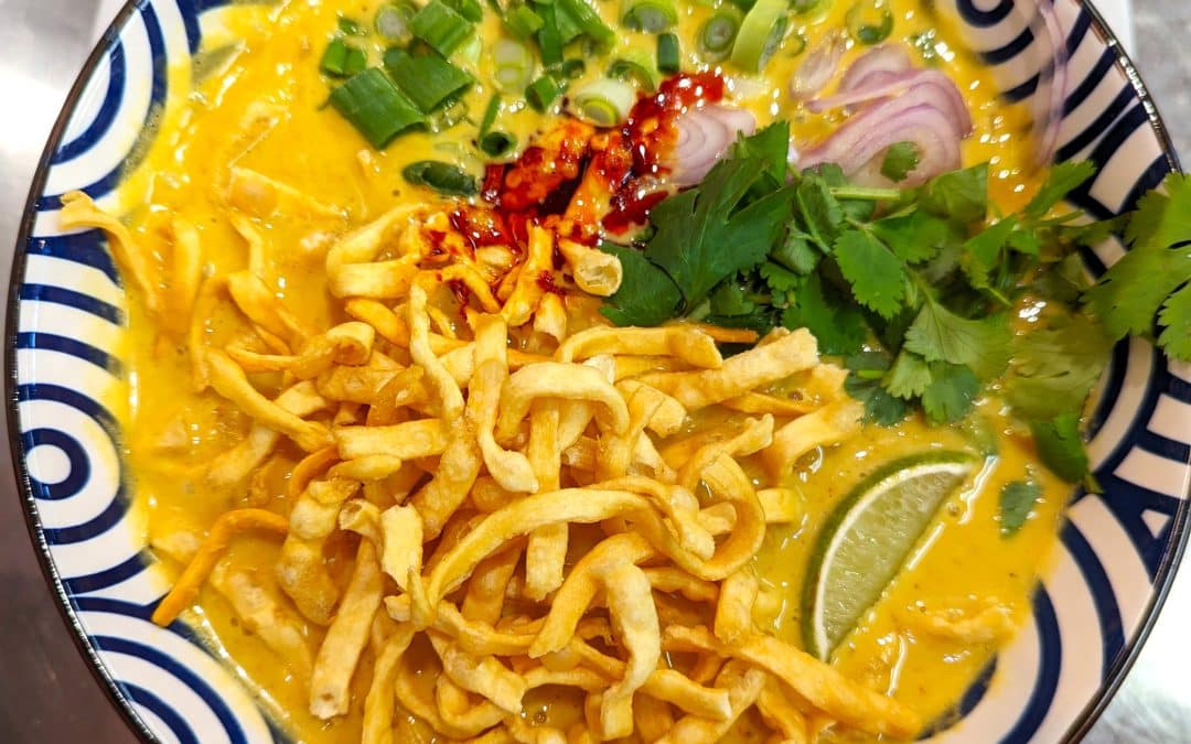 Thai curry noodles from Tasty Thai Tempe with egg noodles, coconut curry broth, and crispy noodles on top near Broadway Road.