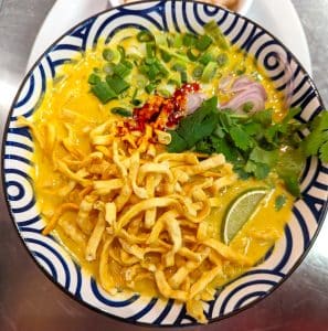 Thai curry noodles from Tasty Thai Tempe with egg noodles, coconut curry broth, and crispy noodles on top near Broadway Road.