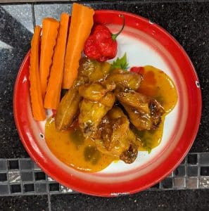Mango Hellfire ghost pepper chicken wings at Tasty Thai in Tempe, Arizona